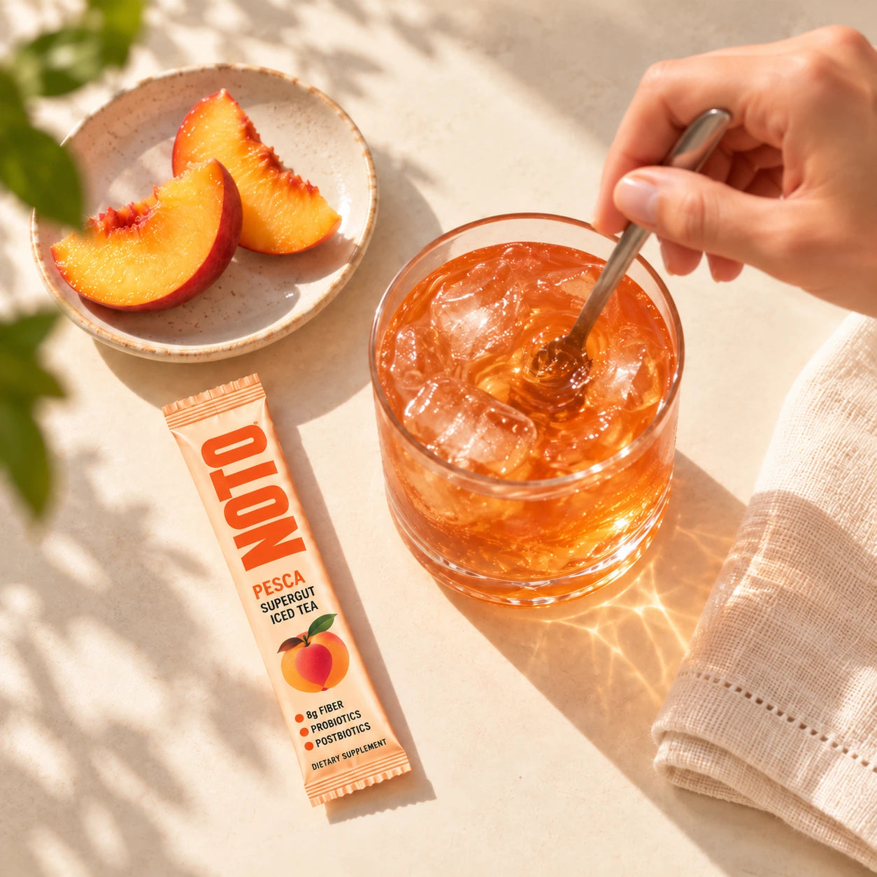 NOTO PESCA sachet beside iced tea being stirred